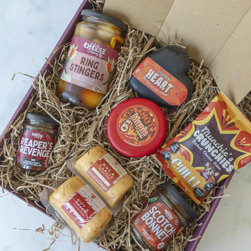 Overhead All About The Burn Hamper with chilli cheeses, jams, Crunchies and Ring Stingers