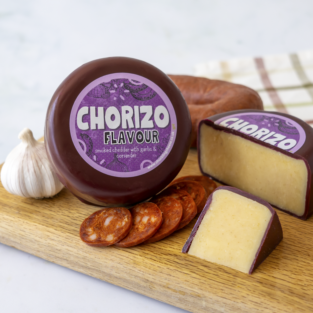 Chorizo Cheddar Truckle with sliced cheddar and chorizo on a cheeseboard