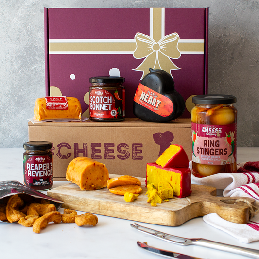 Chuckling Cheese corporate gift hamper with Flamin’ Heart Cheddar, Scotch Bonnet jam, Ring Stingers and savoury snacks