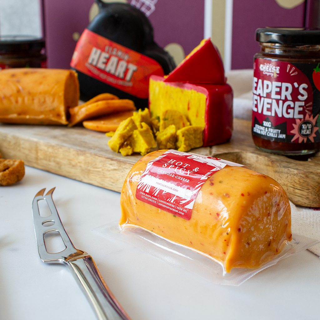 Chuckling Cheese Hot & Spicy Cheddar with Flamin’ Heart cheese, red cheese wedges, Reaper’s Revenge chilli jam and cheese board accompaniments