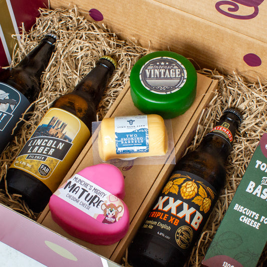Chuckling Cheese gift hamper with beer bottles, Vintage Cheddar, Mighty Mature Heart Cheddar and cheese biscuits