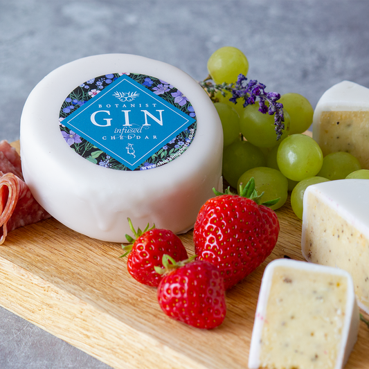 Chuckling Cheese Botanist Gin & Tonic Cheddar with strawberries, grapes and sliced cheese