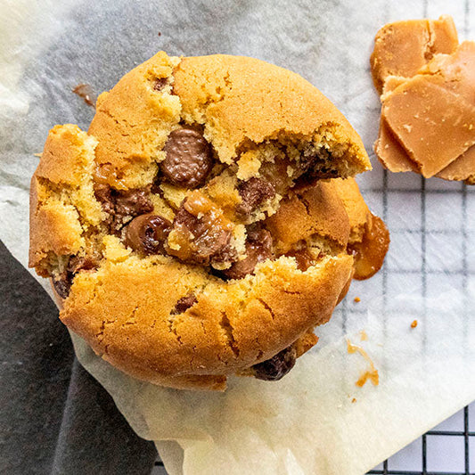 Homemade chocolate chip cookie stuffed with gooey Biscoff fudge centre