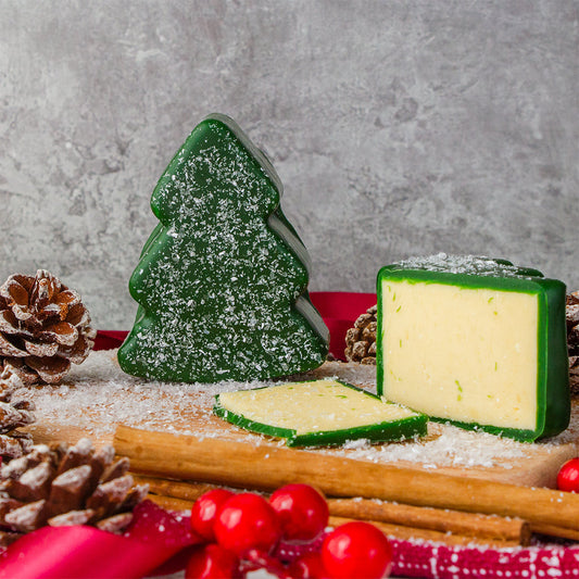 Chuckling Cheese Christmas tree shaped cheddar with festive cheese slices and cranberries