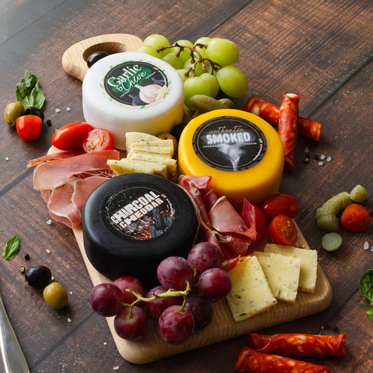 Chuckling Cheese gift cheeseboard with Garlic & Chive, Smoked and Charcoal cheddar truckles