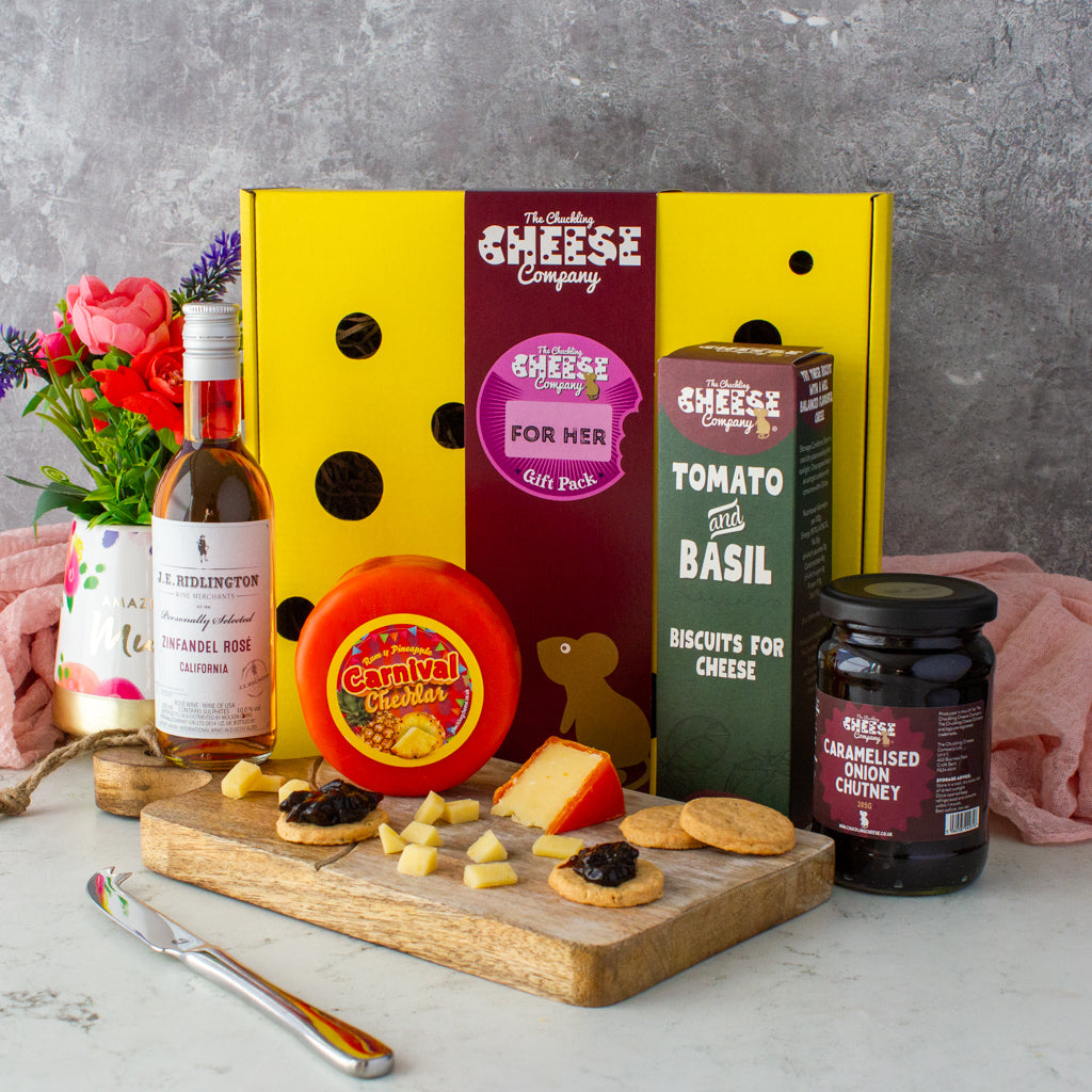 Chuckling Cheese For Her gift box with Carnival Cheddar, rosé wine, Tomato & Basil biscuits, caramelised onion chutney and flowers