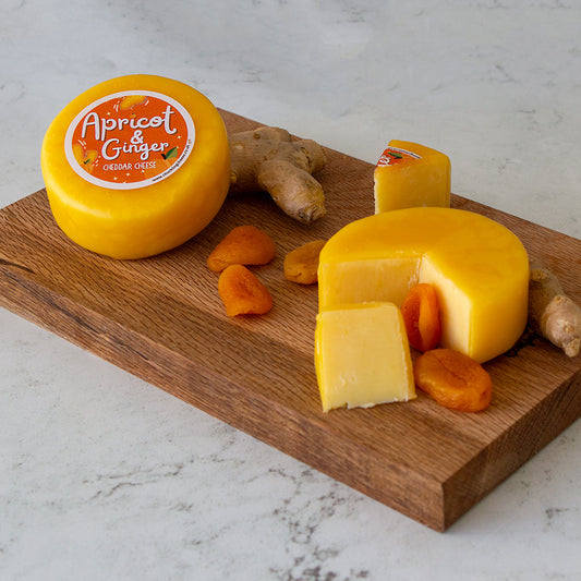 Chuckling Cheese Apricot & Ginger Cheddar Truckle with sliced cheese, dried apricots and ginger