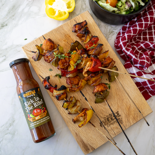 Grilled BBQ chicken skewers served with Kick in the Ribs sauce