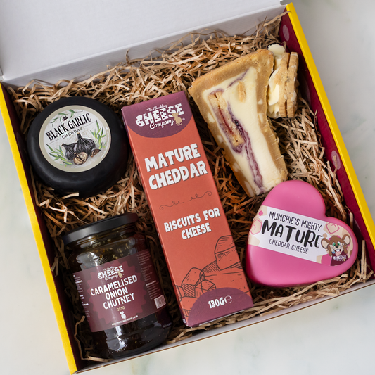 Mother’s Day cheese gift box with Black Garlic and Mature Mini Truckles, caramelised onion chutney, mature cheddar biscuits and a cheese sandwich.