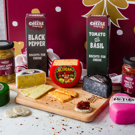 Chuckling Cheese Easter cheese hamper with biscuits, chutneys, waxed cheddar truckles and snacks