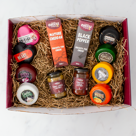 Corporate cheese hamper filled with assorted cheddar cheeses, biscuits, chutneys and savoury accompaniments.