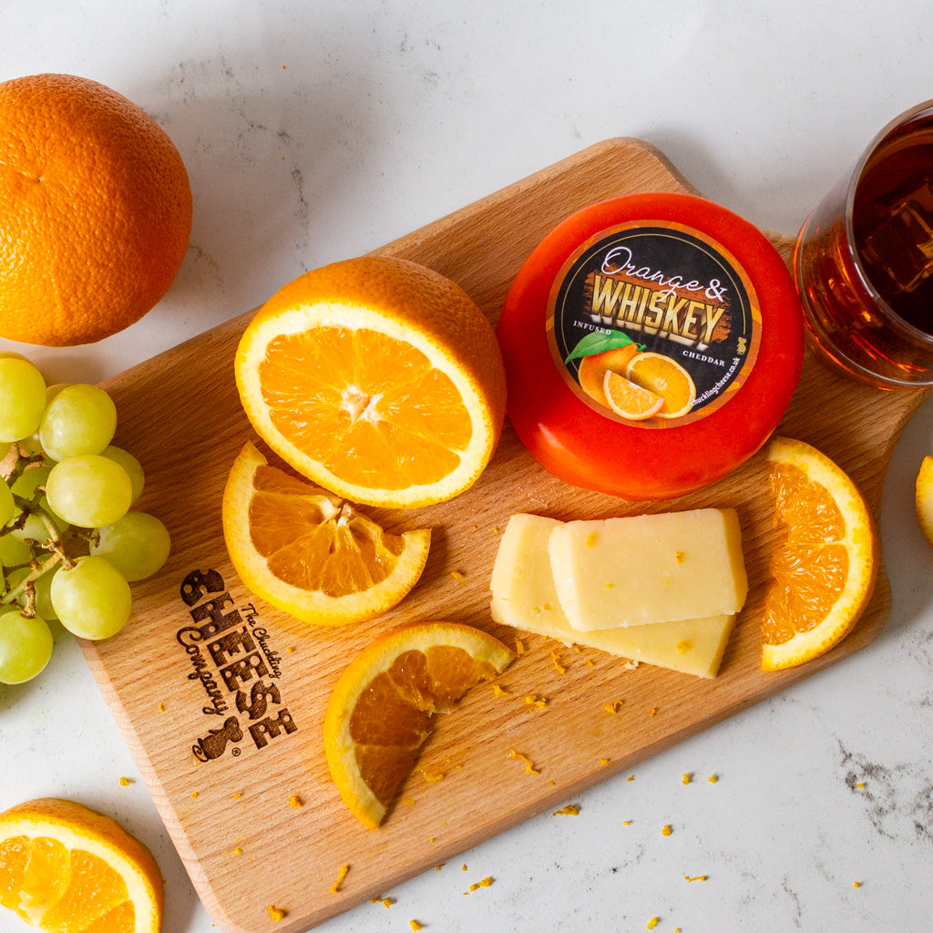 Chuckling Cheese Orange & Whisky Cheddar Truckle with orange slices, grapes and whisky