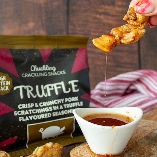 Chuckling Cheese truffle pork scratchings with dipping sauce for Christmas cheeseboards