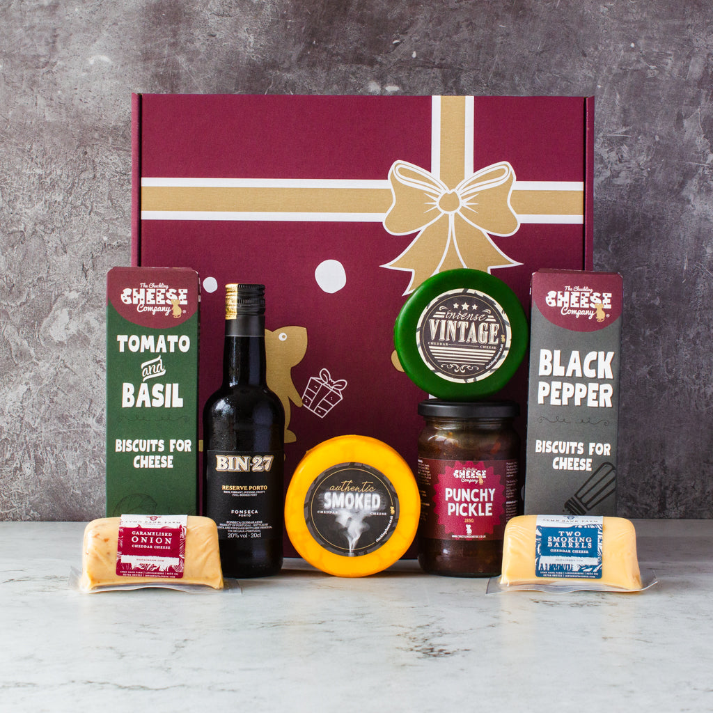 Chuckling Cheese hamper with wine, Vintage and Smoked cheddar truckles, Punchy Pickle, biscuits and cheese accessories