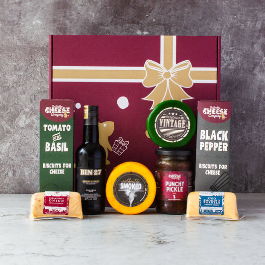 Chuckling Cheese hamper with wine, Vintage and Smoked cheddar truckles, Punchy Pickle, biscuits and cheese accessories