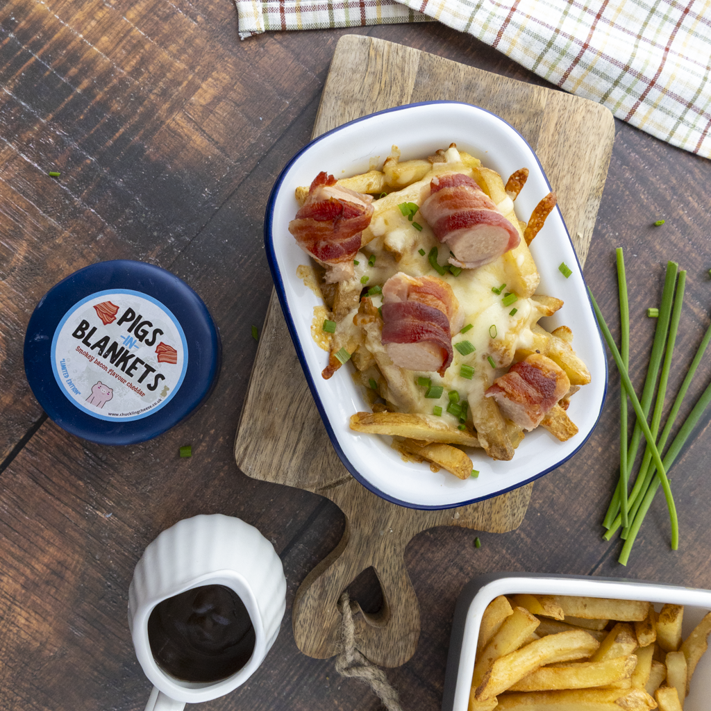 Chuckling Cheese pigs in blankets loaded fries with melted cheese, gravy and festive cheese truckle