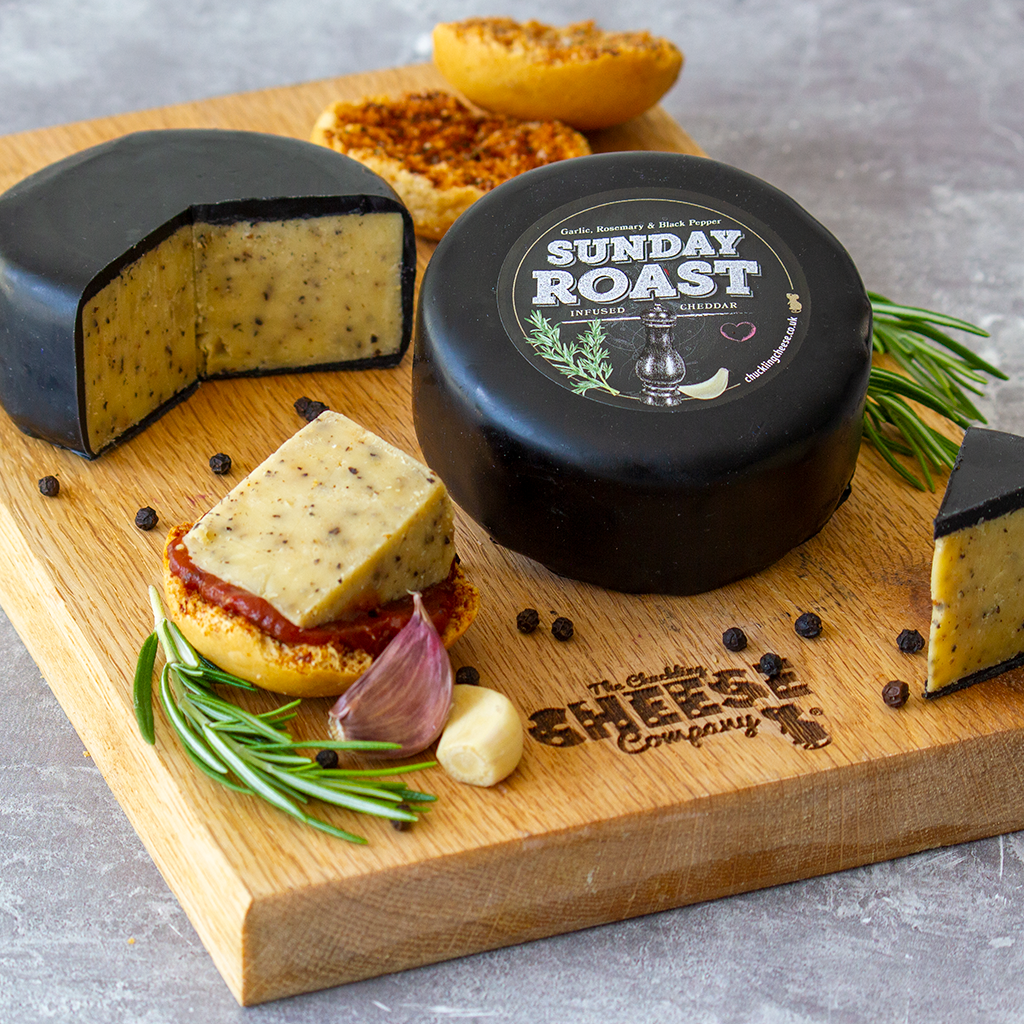 Chuckling Cheese Sunday Roast Cheddar Truckle with rosemary, garlic and sliced cheese