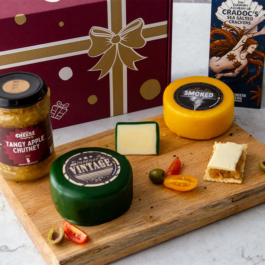 Chuckling Cheese hamper with Tangy Apple Chutney, Vintage Cheddar, Smoked Cheddar, crackers and cheese slices