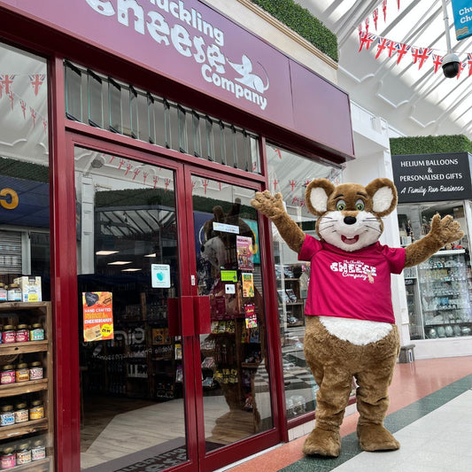 The Chuckling Cheese Company store in Skegness with its mouse mascot outside the entrance.