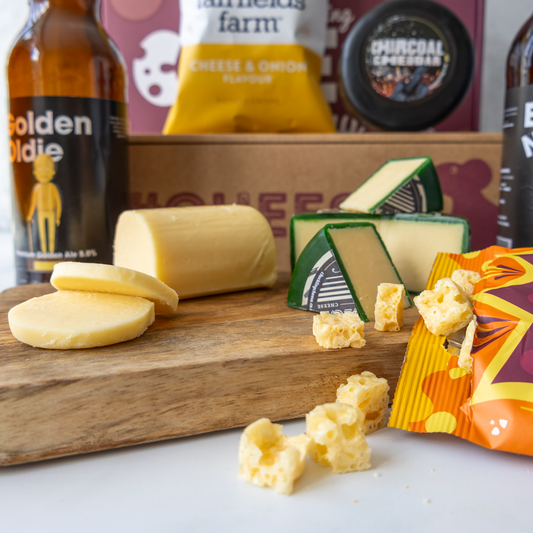 Chuckling Cheese tasting hamper with Vintage Cheddar, Charcoal Cheddar, Golden Oldie beer, cheese bites, crisps and gift box