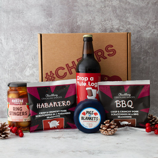 Chuckling Cheese Christmas gift box with Drop a Yule Log beer, Pigs in Blankets Cheddar, Ring Stingers and pork scratchings