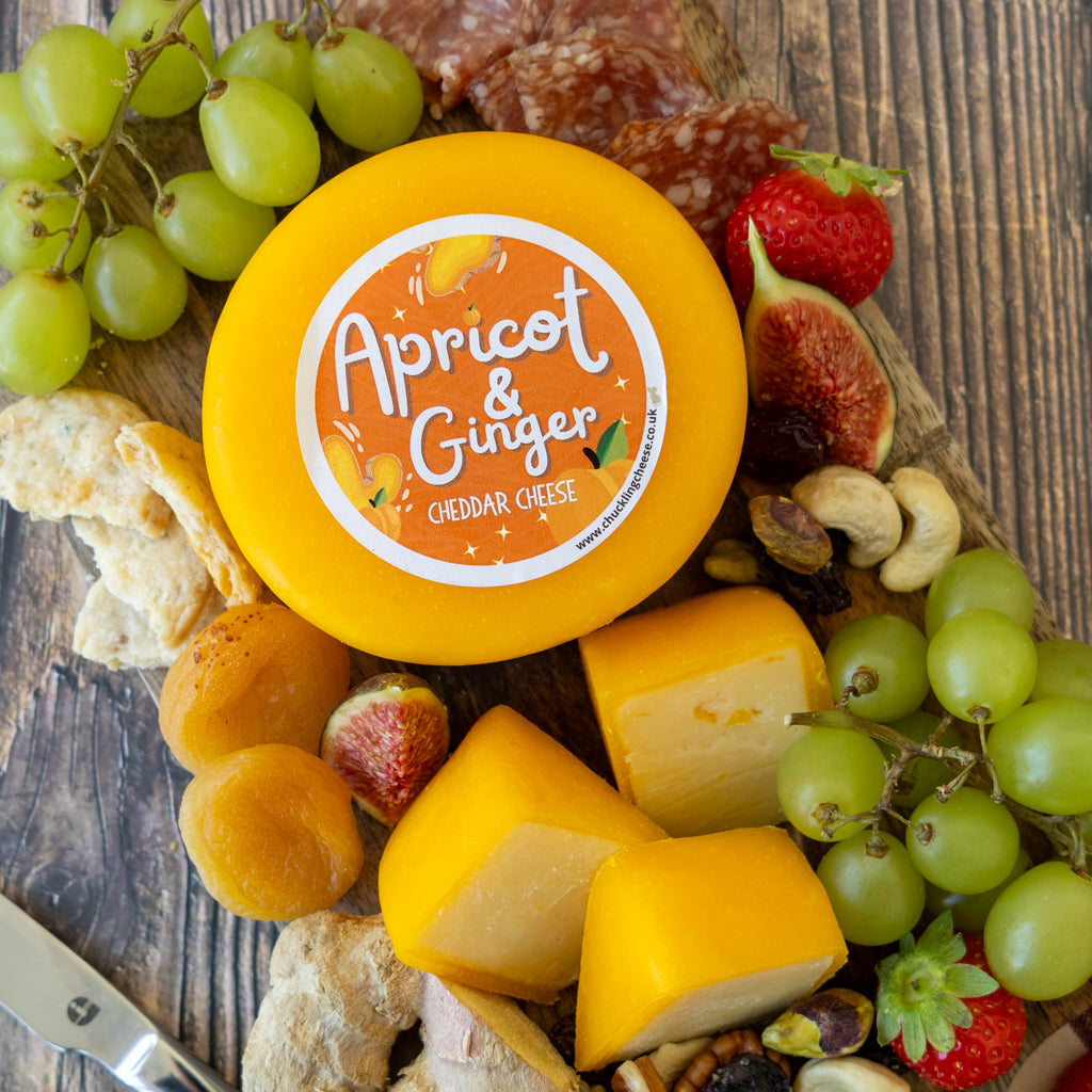 Apricot & Ginger Cheddar Truckle cheeseboard with grapes, cheese cubes, dried apricots and savoury accompaniments