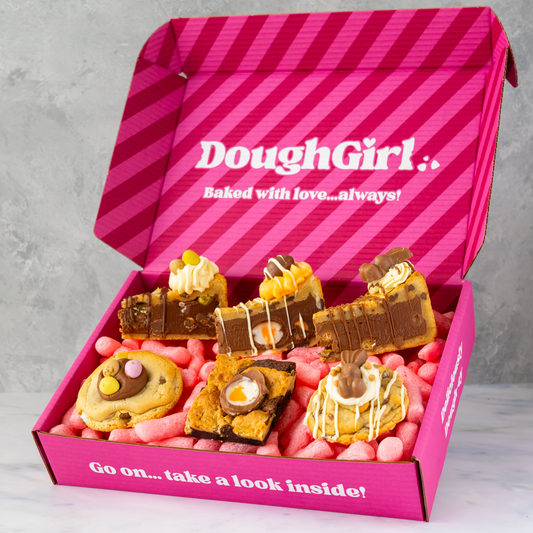 Pink DoughGirl Easter Bundle box with cookies and cookie pies on a gray background