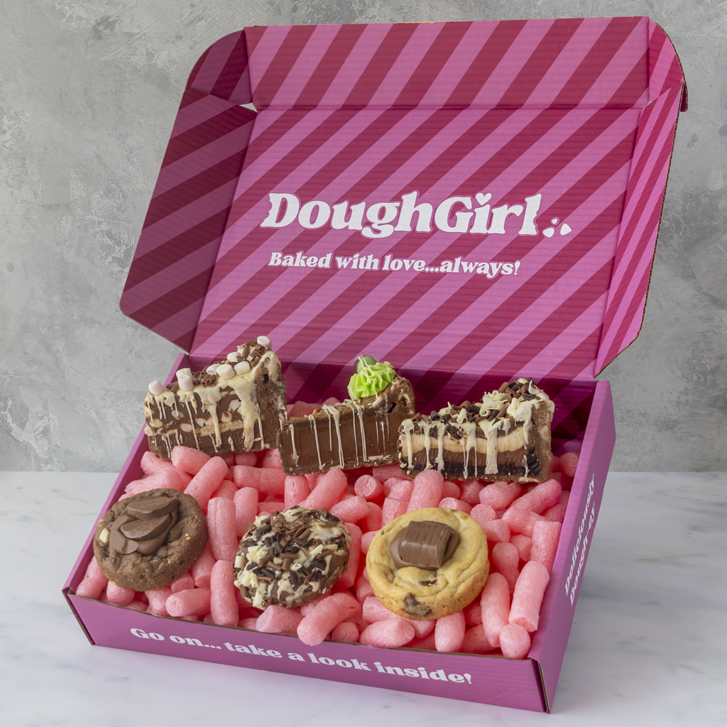 Open DoughGirl Milk Chocolate Bundle gift box filled with cookie pie slices and deluxe cookies