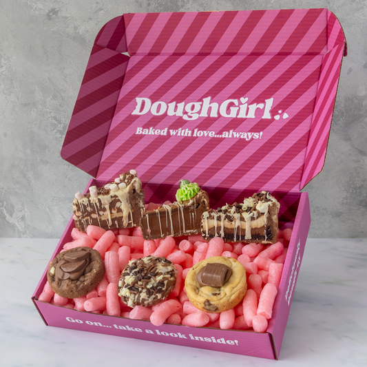 Open DoughGirl Milk Chocolate Bundle gift box filled with cookie pie slices and deluxe cookies