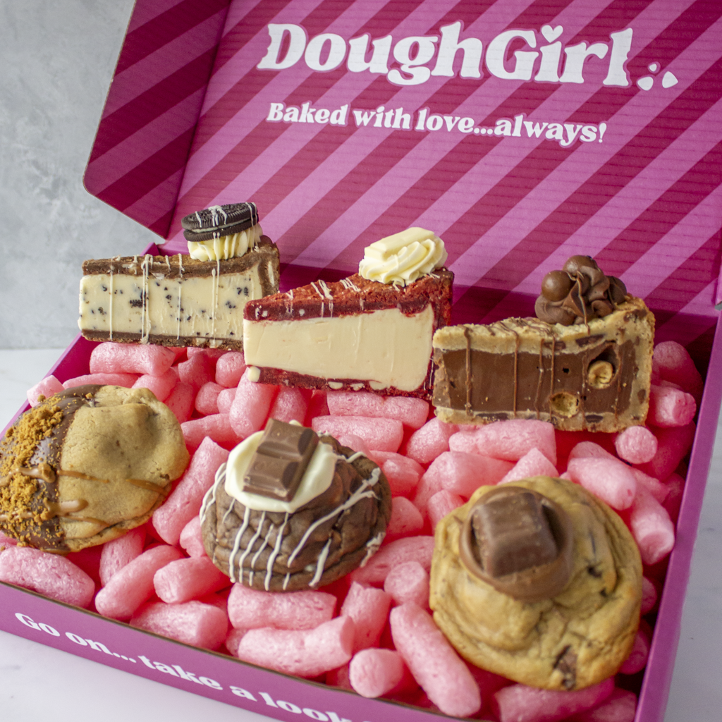 Close-up of DoughGirl New Home Bundle with deluxe cookies and cookie pie slices