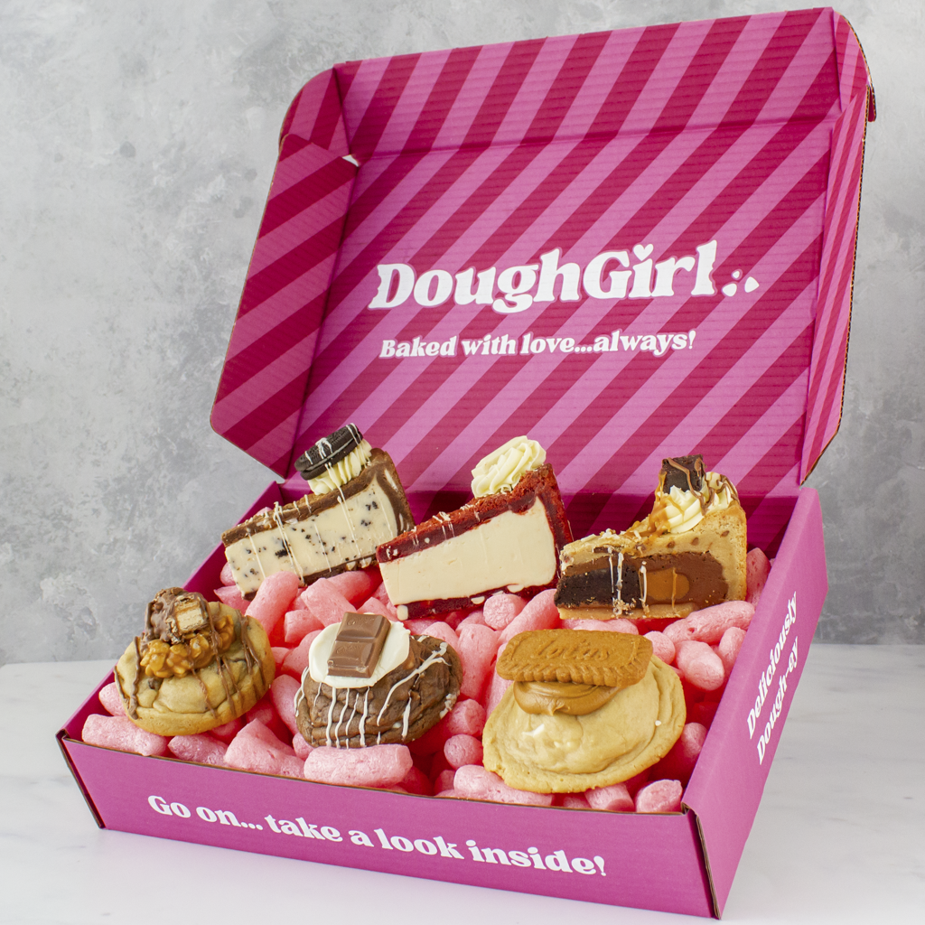 Pink Thank You DoughGirl box with cookies and cookie pies on a gray background