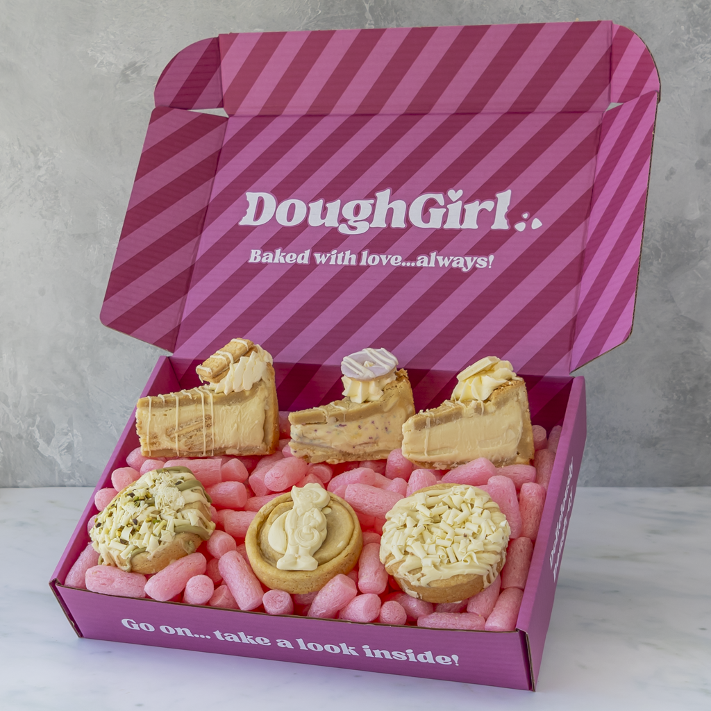 An open pink gift box with diagonal stripes and the text 'DoughGirl.