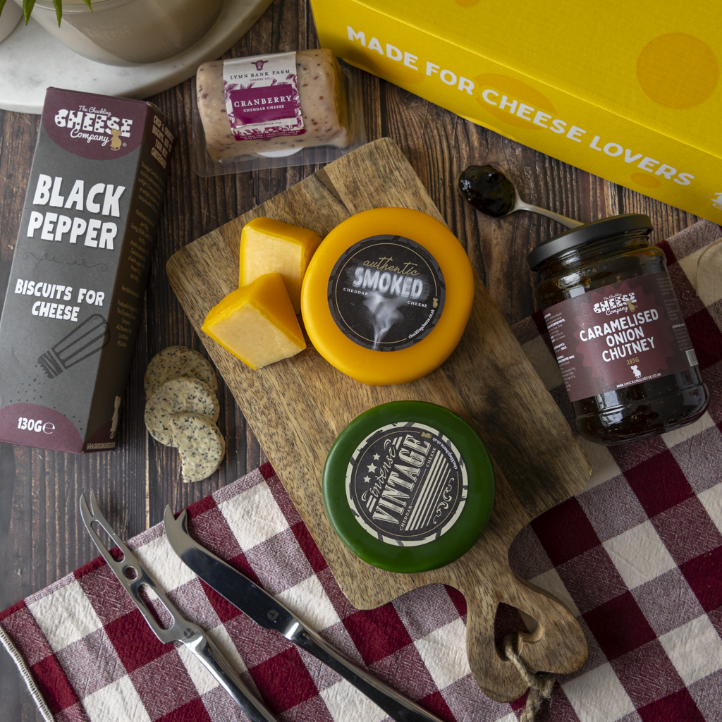 Classic Cheeseboard Gift Box with cheddar cheeses, Black Pepper biscuits, caramelised onion chutney, crackers and cheese cubes.
