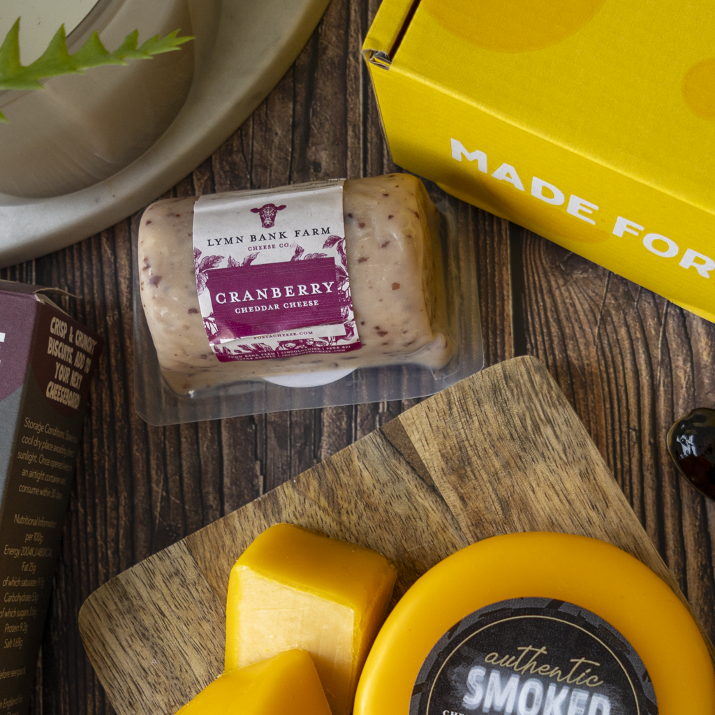 Cranberry Cheddar with Authentic Smoked Cheddar and cheese cubes from the Classic Cheeseboard Gift Box.
