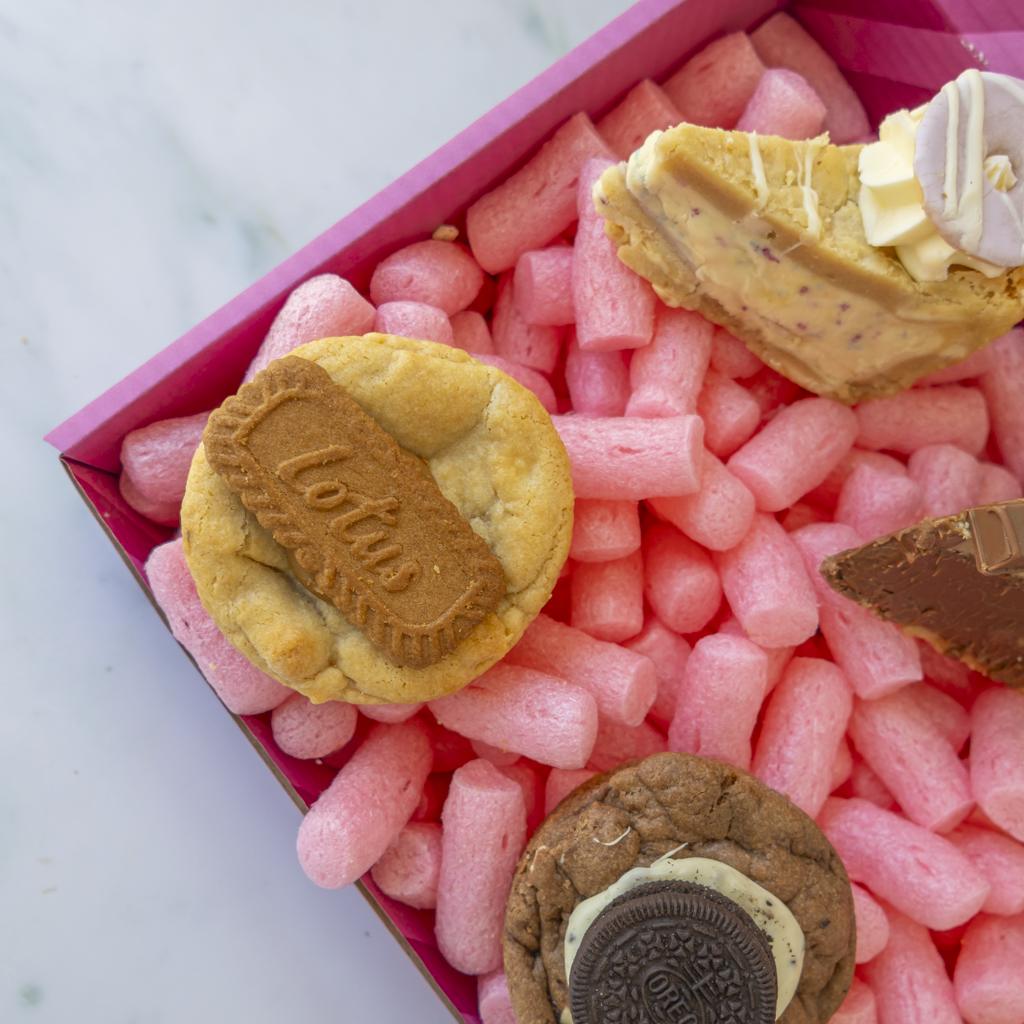 Close-up of a Lotus Biscoff cookie and assorted sweet treats
