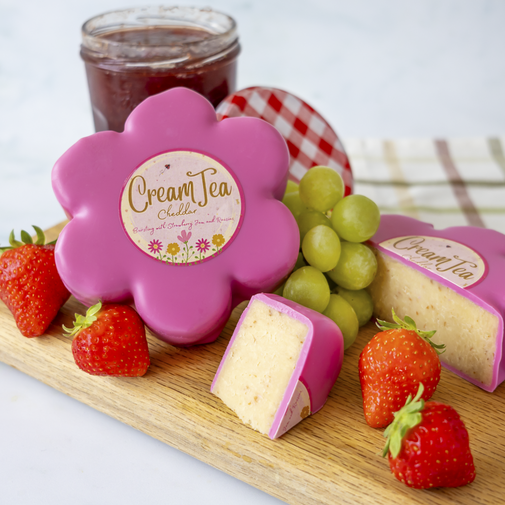Chuckling Cheese Cream Tea Cheddar Truckle with strawberries, grapes and jam