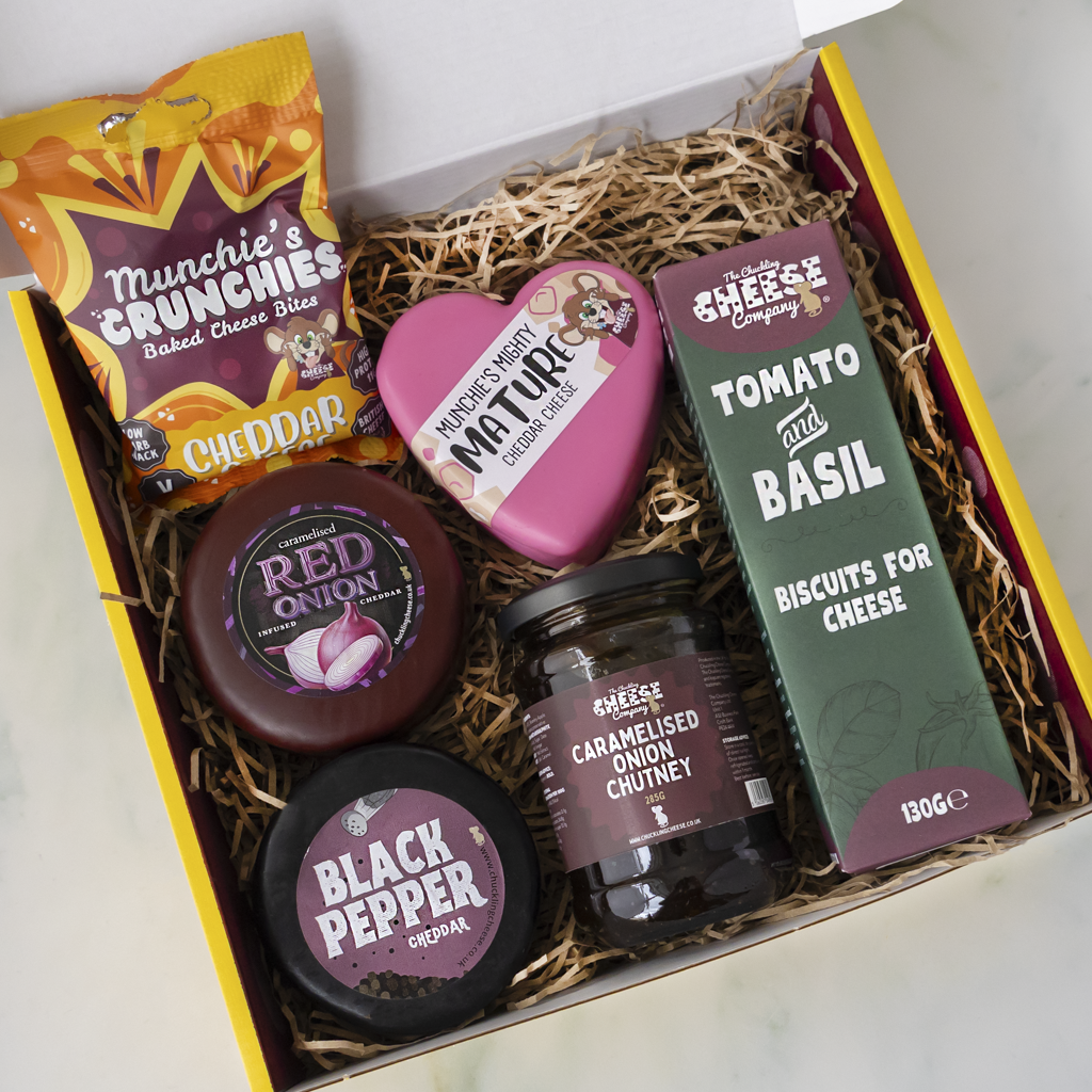 Open Cheese Queen Gift Box by The Chuckling Cheese Company with cheese truckles, chutney, biscuits and crunchy cheese snacks