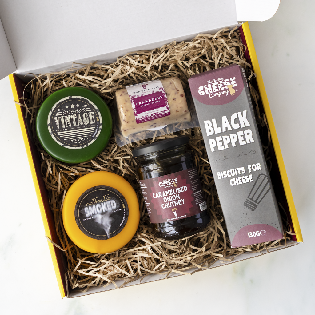 Classic Cheese Gift Box with Intense Vintage Cheddar, Authentic Smoked Cheddar, Cranberry Cheddar, caramelised onion chutney and Black Pepper biscuits for cheese.