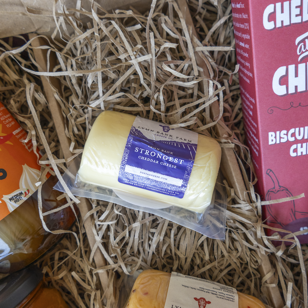 Strongest Cheddar Barrel packed in straw inside Farty Pants hamper