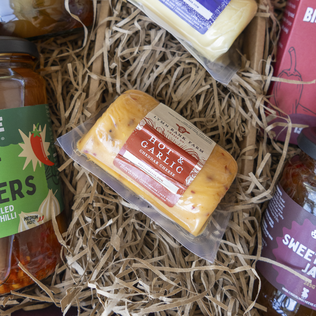 Hot & Garlic Cheddar Barrel packed in straw inside Farty Pants hamper