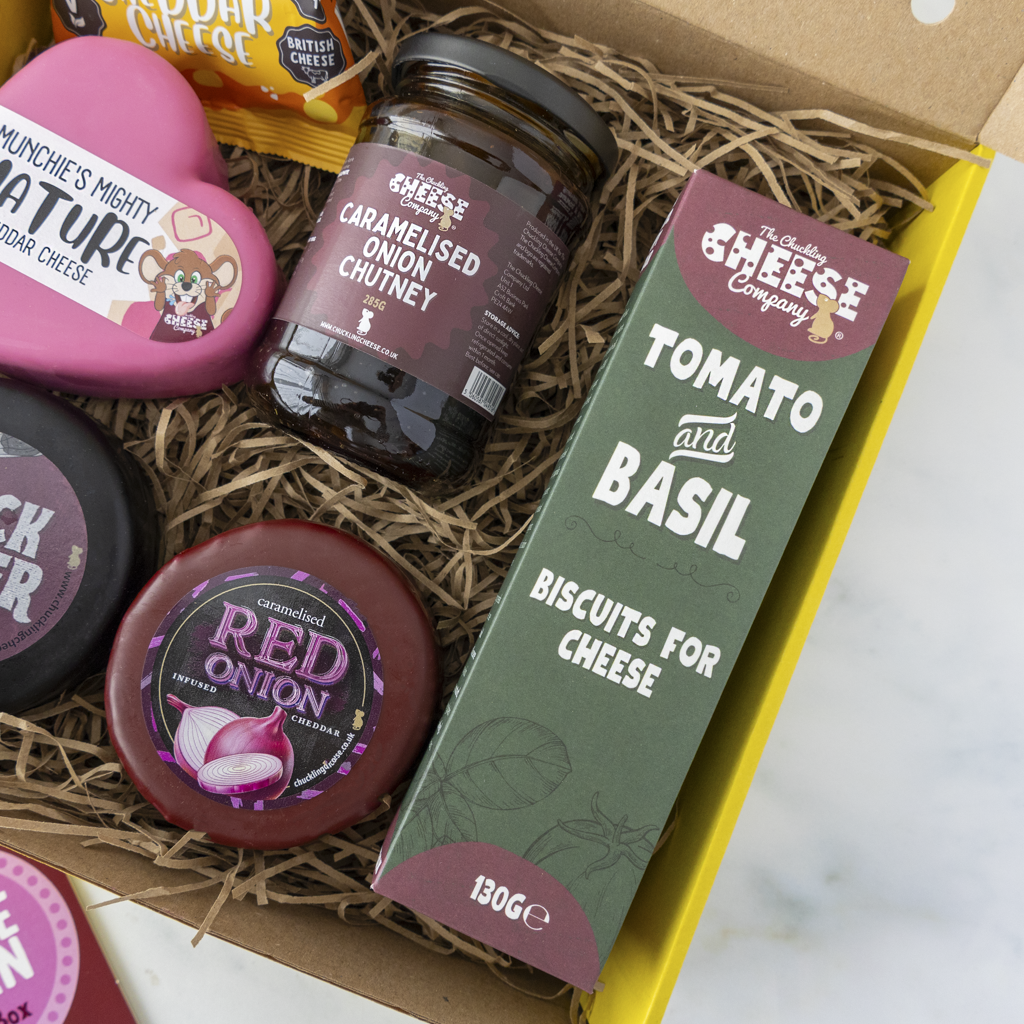 Cheese Queen Gift Box close up with waxed cheese truckles and snack selection