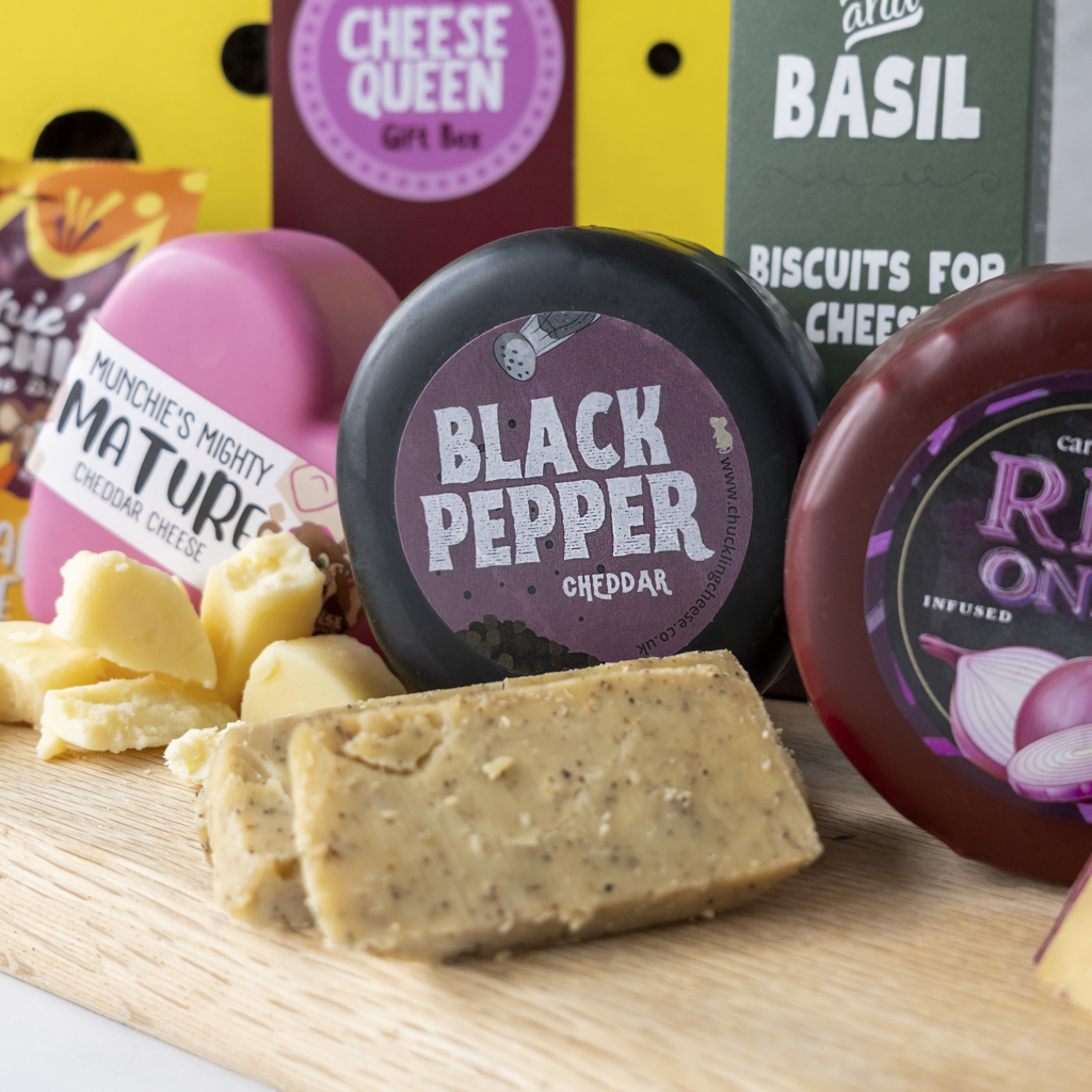 Cheese Queen Gift Box close up with Black Pepper Cheddar Truckle and snacks