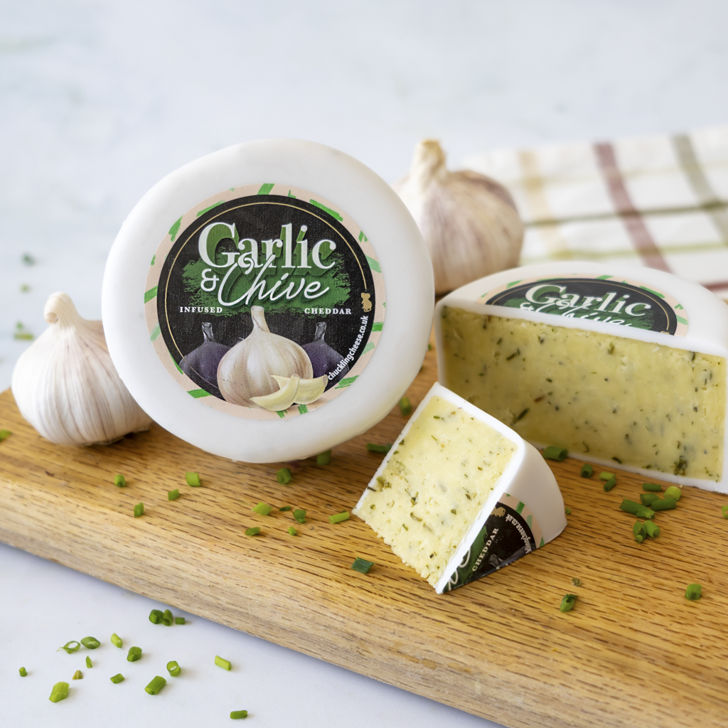 Chuckling Cheese Garlic & Chive Cheddar Truckle with garlic, chives and cheese wedges