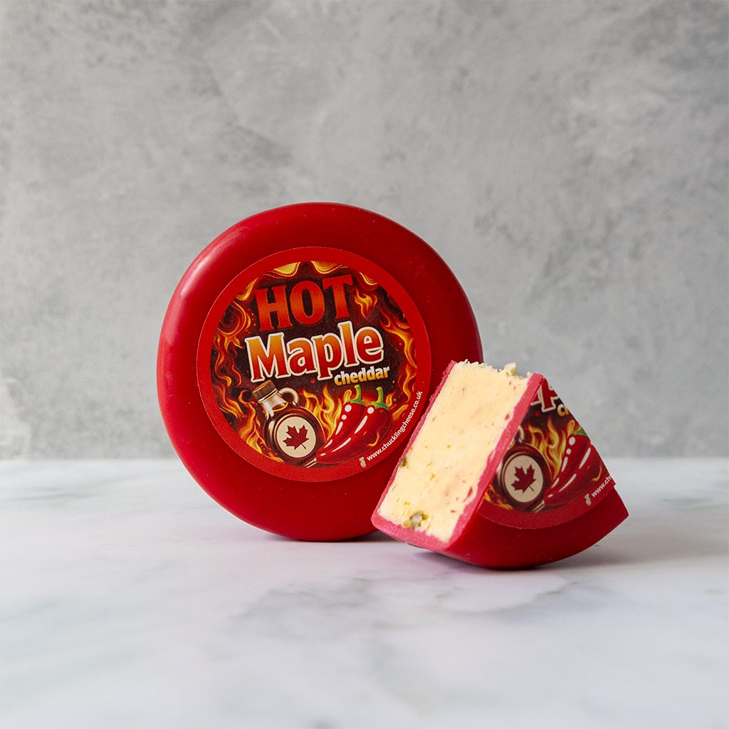 Hot Maple Cheddar Truckle with a cut wedge of sweet and spicy cheddar