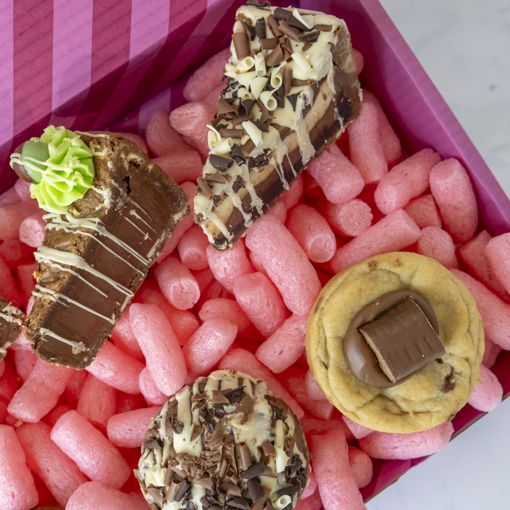 Close-up of assorted chocolate cookies and cookie pie slices in the DoughGirl bundle
