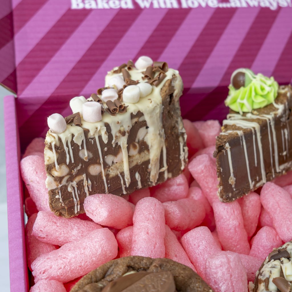 Milk chocolate dessert gift box featuring cookie pie slices and deluxe cookies