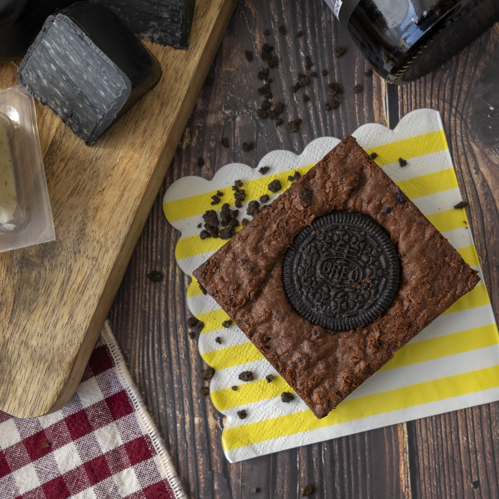 Chocolate brownie topped with a sandwich cookie, served as part of the Mr Grumpy Gift Box.
