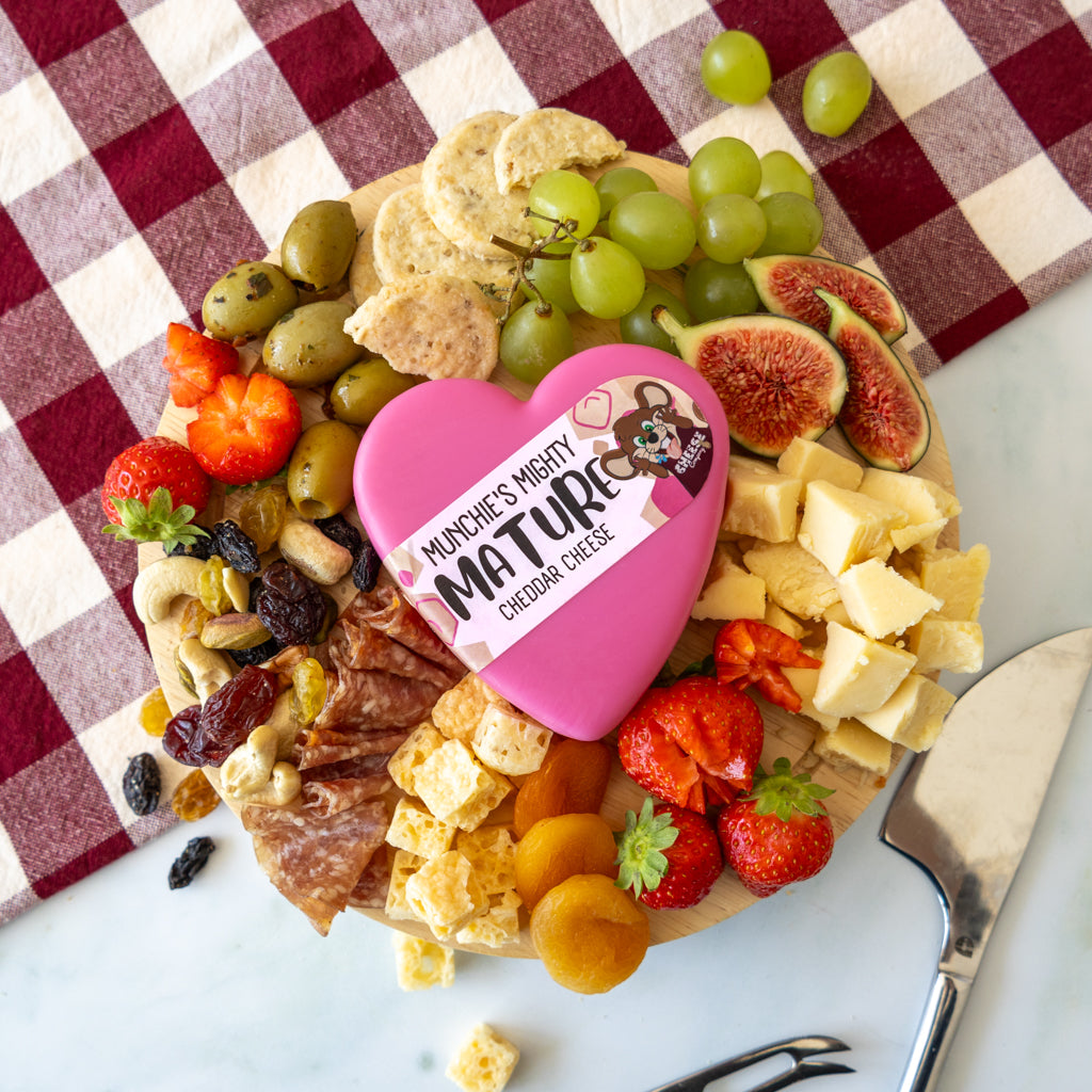 Munchies Mighty Mature Heart Cheddar platter with grapes, crackers, tomatoes and cheese cubes