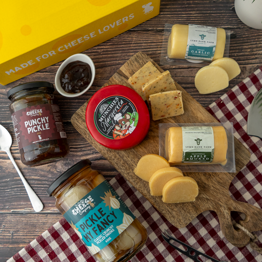 Ploughman’s cheese board with Margarita Cheddar, Creamy Garlic Cheddar, Apple Smoked Cheddar, Punchy Pickle and Pickle My Fancy pickled onions.