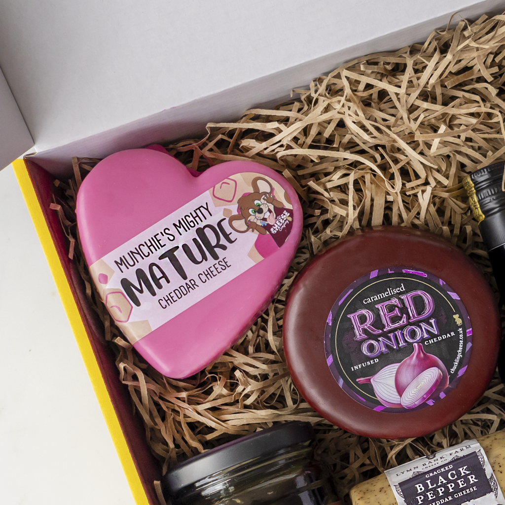 Port & Cheese Gift Box with Mighty Mature Cheddar, Caramelised Red Onion Cheddar, Black Pepper Cheddar and accompaniments.